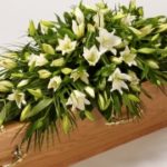 white lily casket spray
